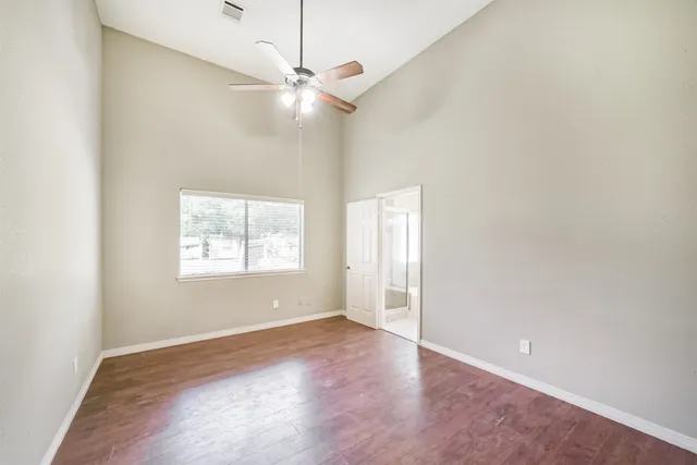 a view of a house with backyard and garden