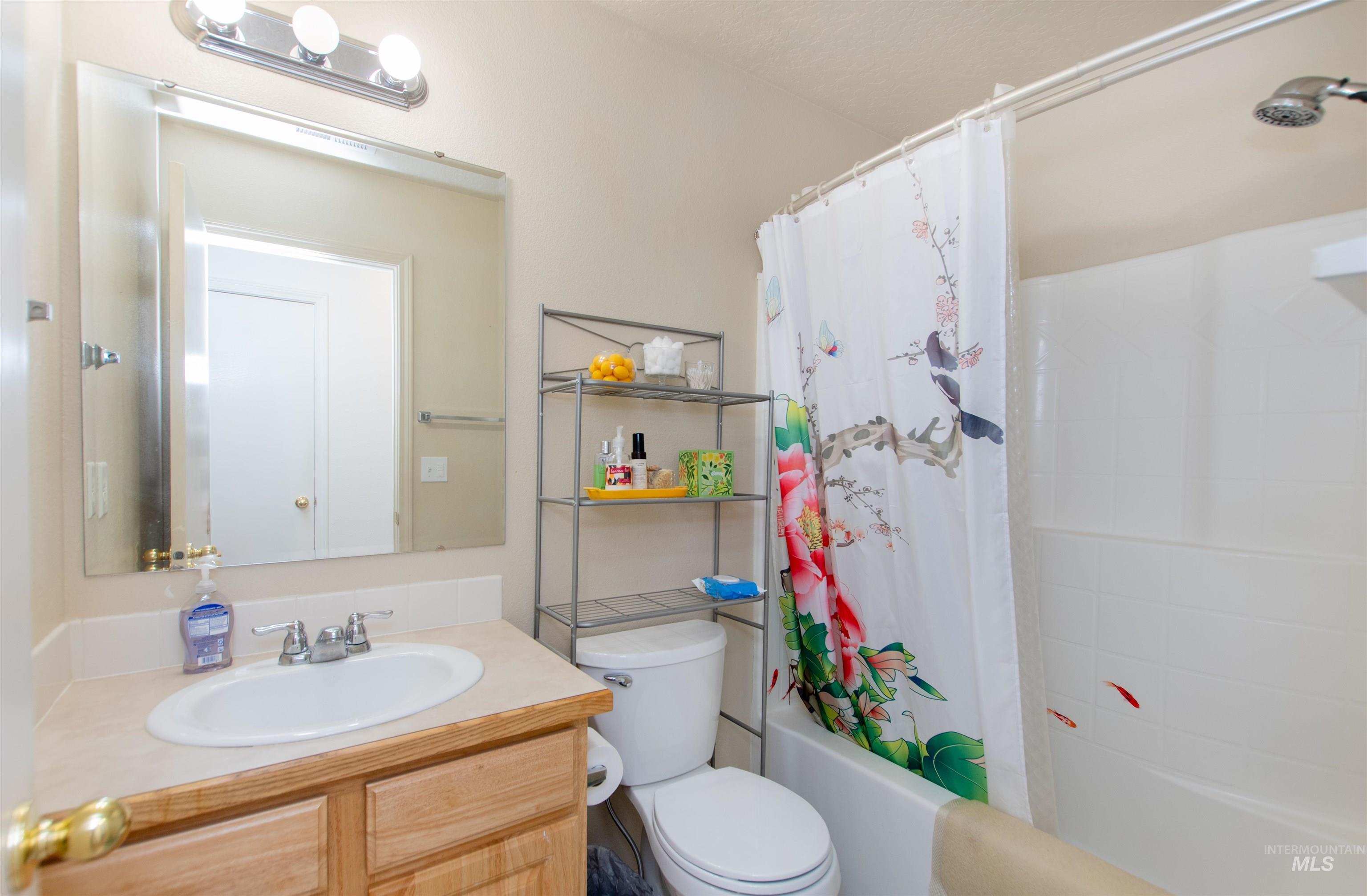 16711 Abram Avenue Caldwell, ID 83607 - Photo 17 of 24 Bathroom featuring vanity and shower / bath combo