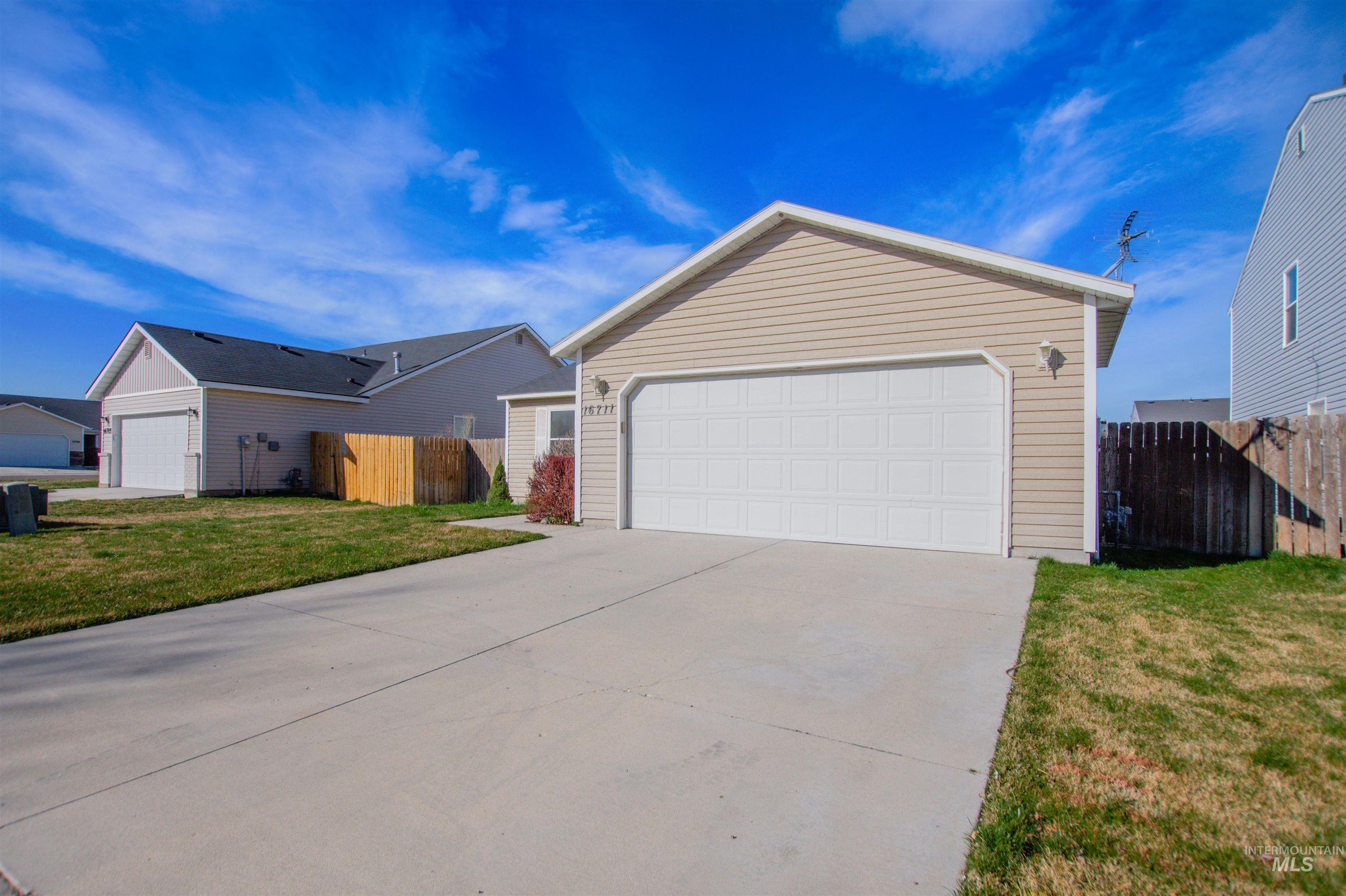 16711 Abram Avenue Caldwell, ID 83607 - Photo 19 of 24 Ranch-style house with a garage and driveway