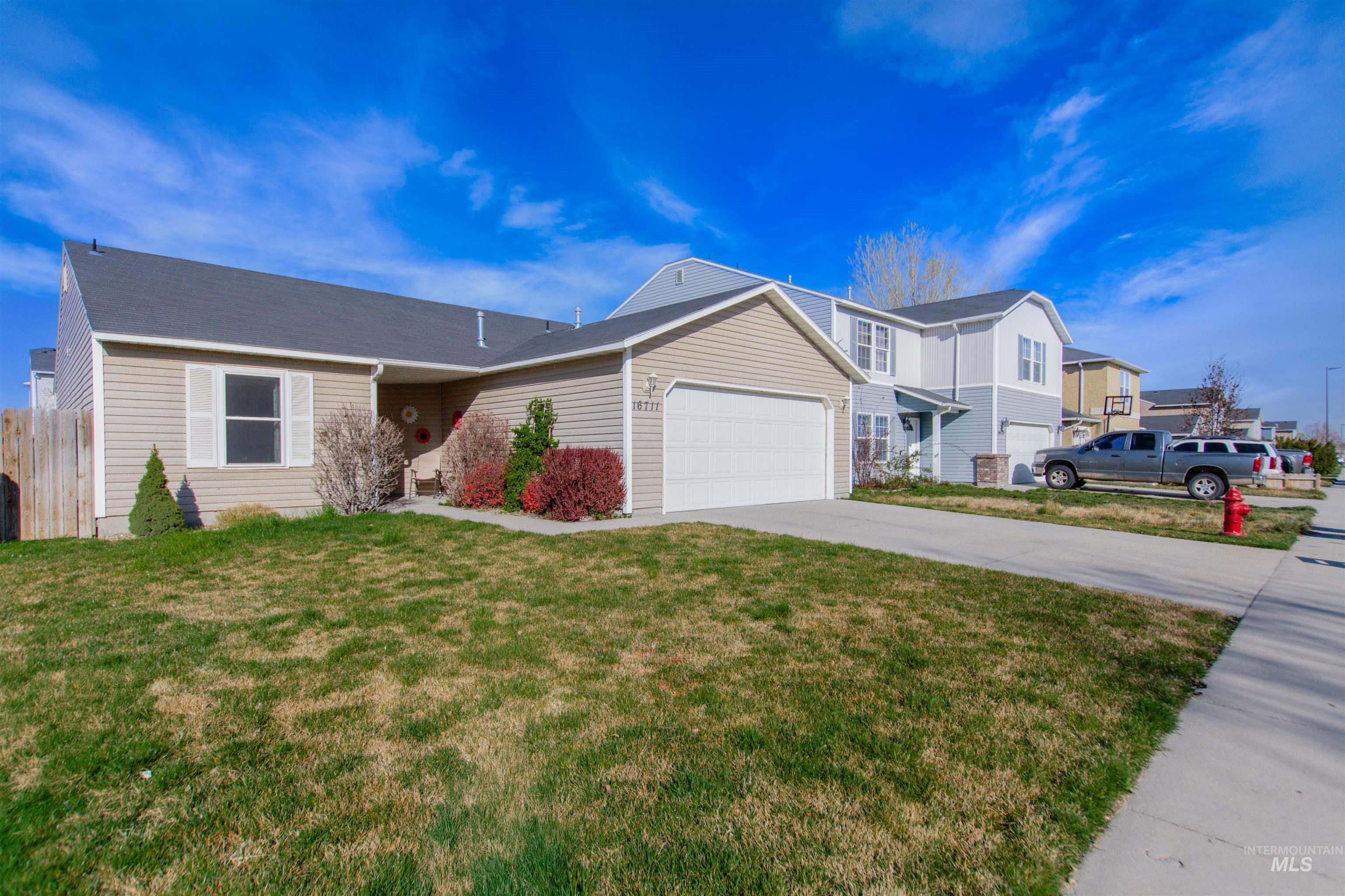 16711 Abram Avenue Caldwell, ID 83607 - Photo 20 of 24 View of front of house with an attached garage and concrete driveway