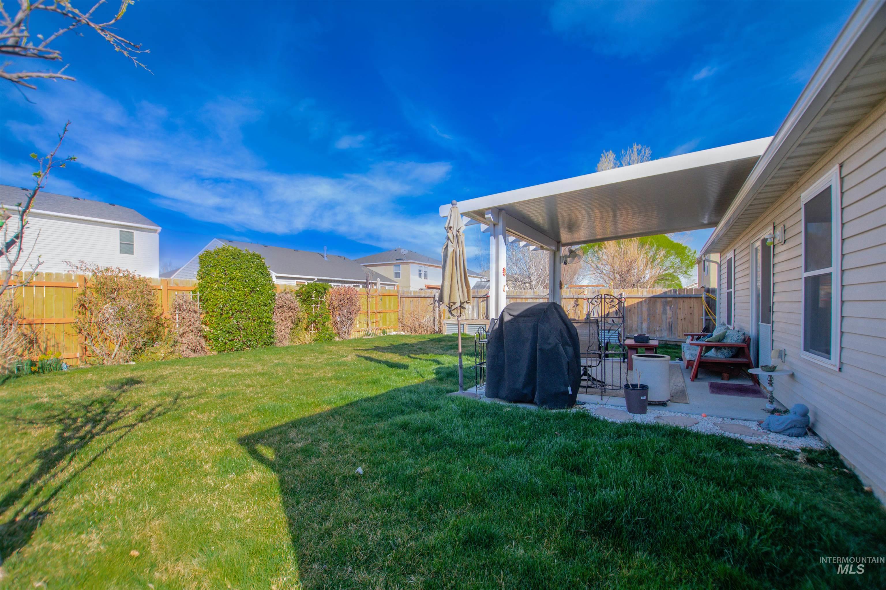 16711 Abram Avenue Caldwell, ID 83607 - Photo 24 of 24 Fenced backyard with a patio