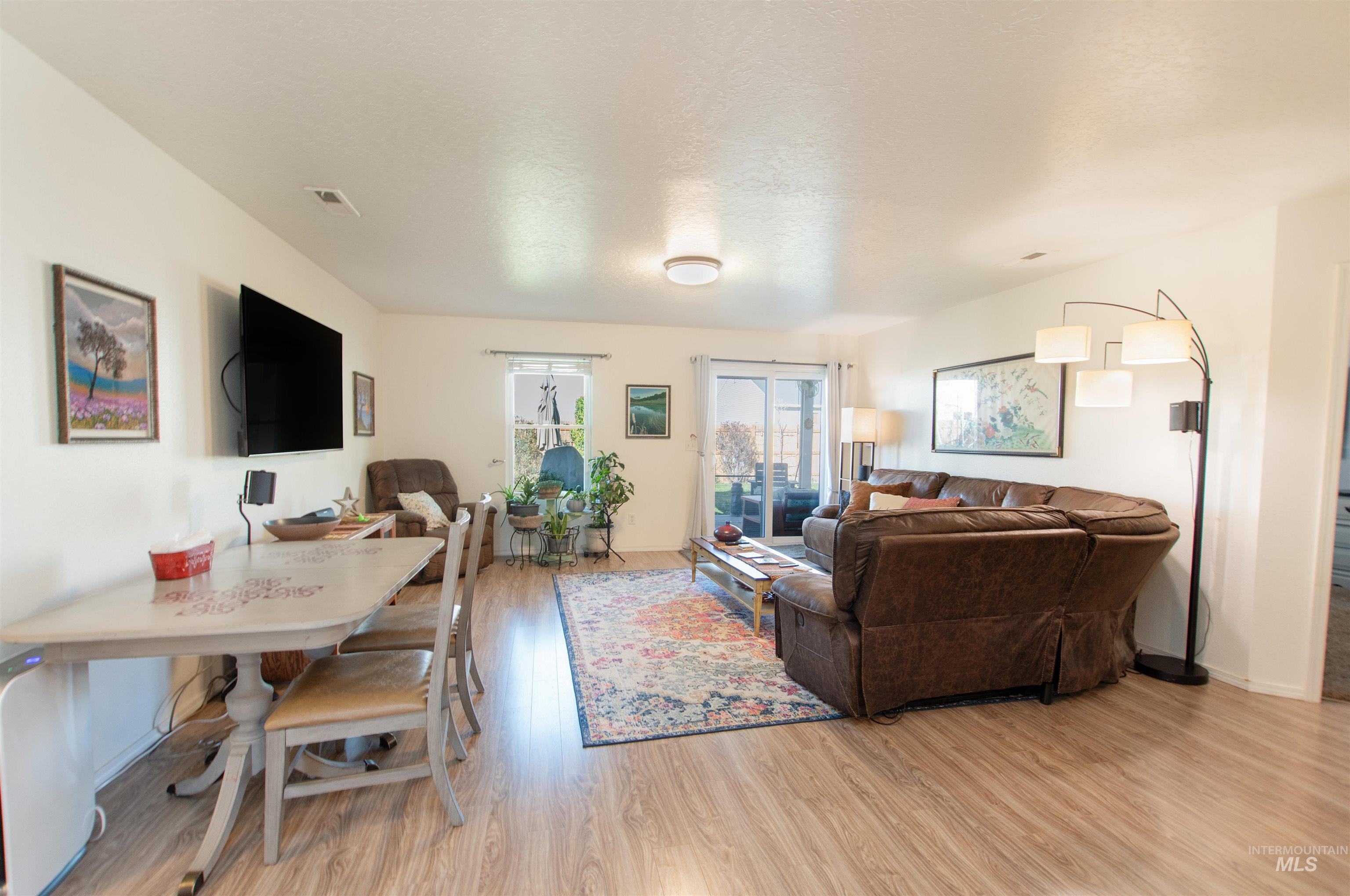 16711 Abram Avenue Caldwell, ID 83607 - Photo 8 of 24 Living room with light wood-style flooring and baseboards