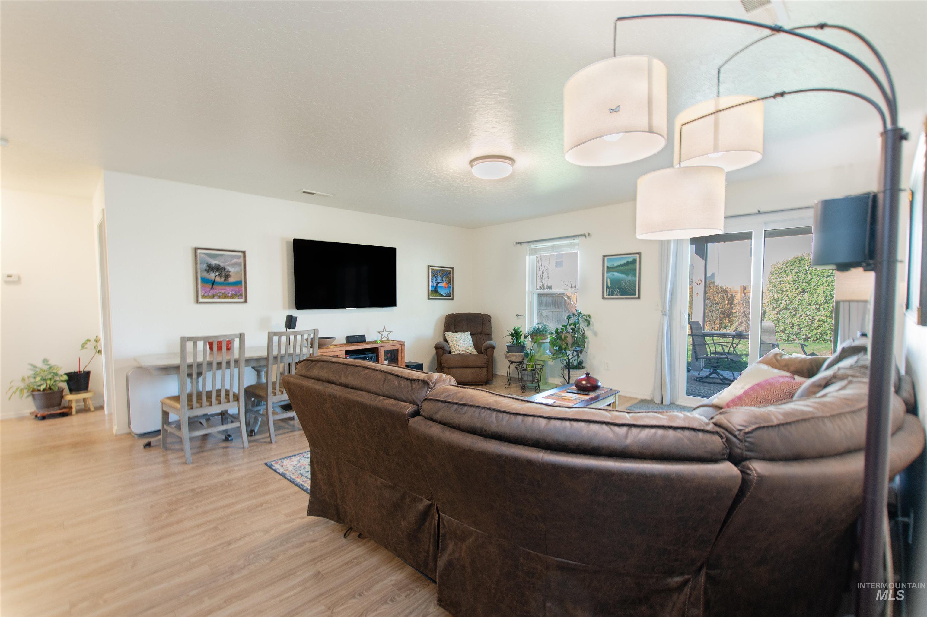 16711 Abram Avenue Caldwell, ID 83607 - Photo 9 of 24 Living area featuring light wood-style flooring