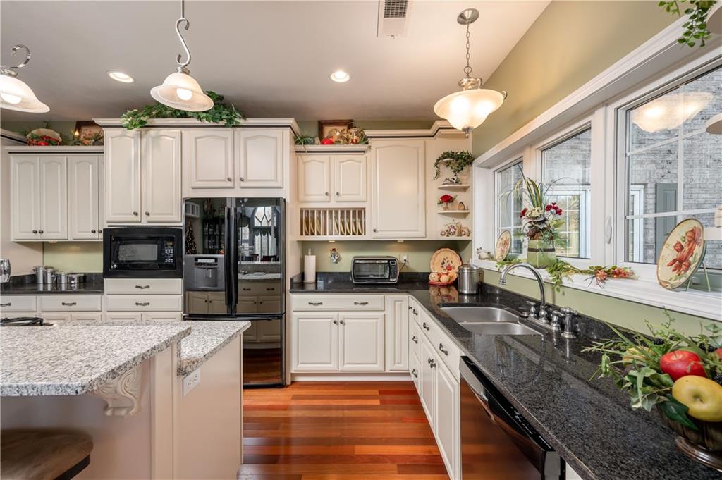 335 North Road Butler, PA 16001 - Photo 8 of 25 a kitchen with granite countertop a sink appliances cabinets and furniture