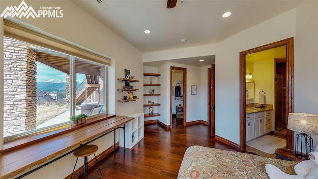 1023 Old North Gate Road Colorado Springs, CO 80921 - Photo 27 of 34 Basement Bedroom w/ view of Pikes Peak, large Walk-in Closet & Adjoining Bath