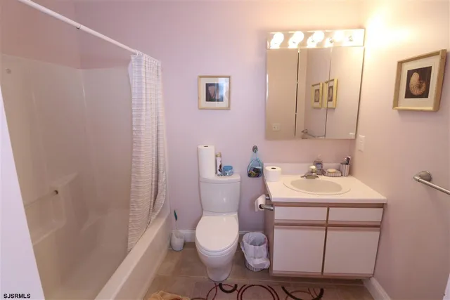 a bathroom with a sink toilet and vanity
