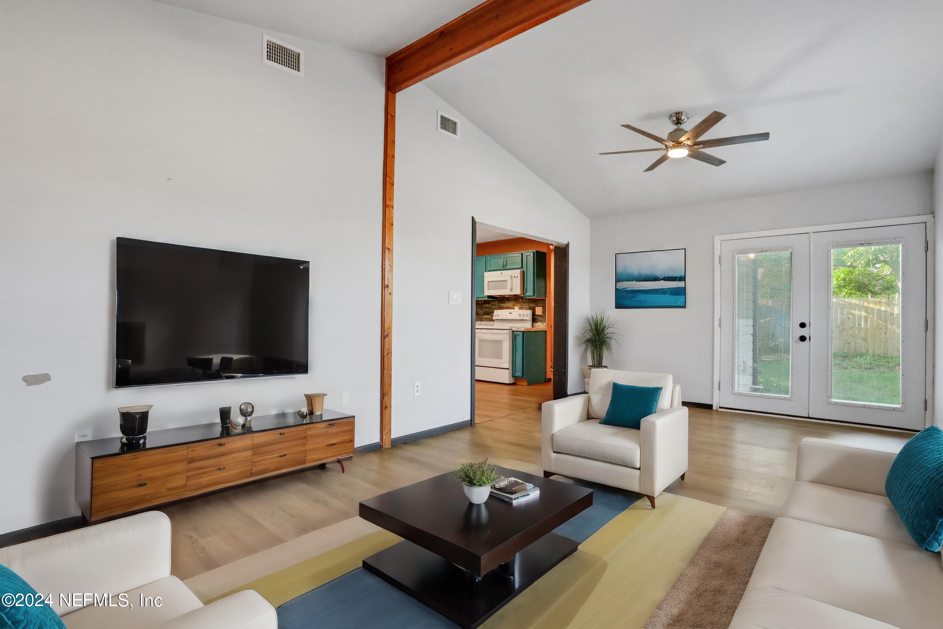 230 Cornell Road St. Augustine, FL 32086 - Photo 1 of 32 a living room with furniture and a flat screen tv