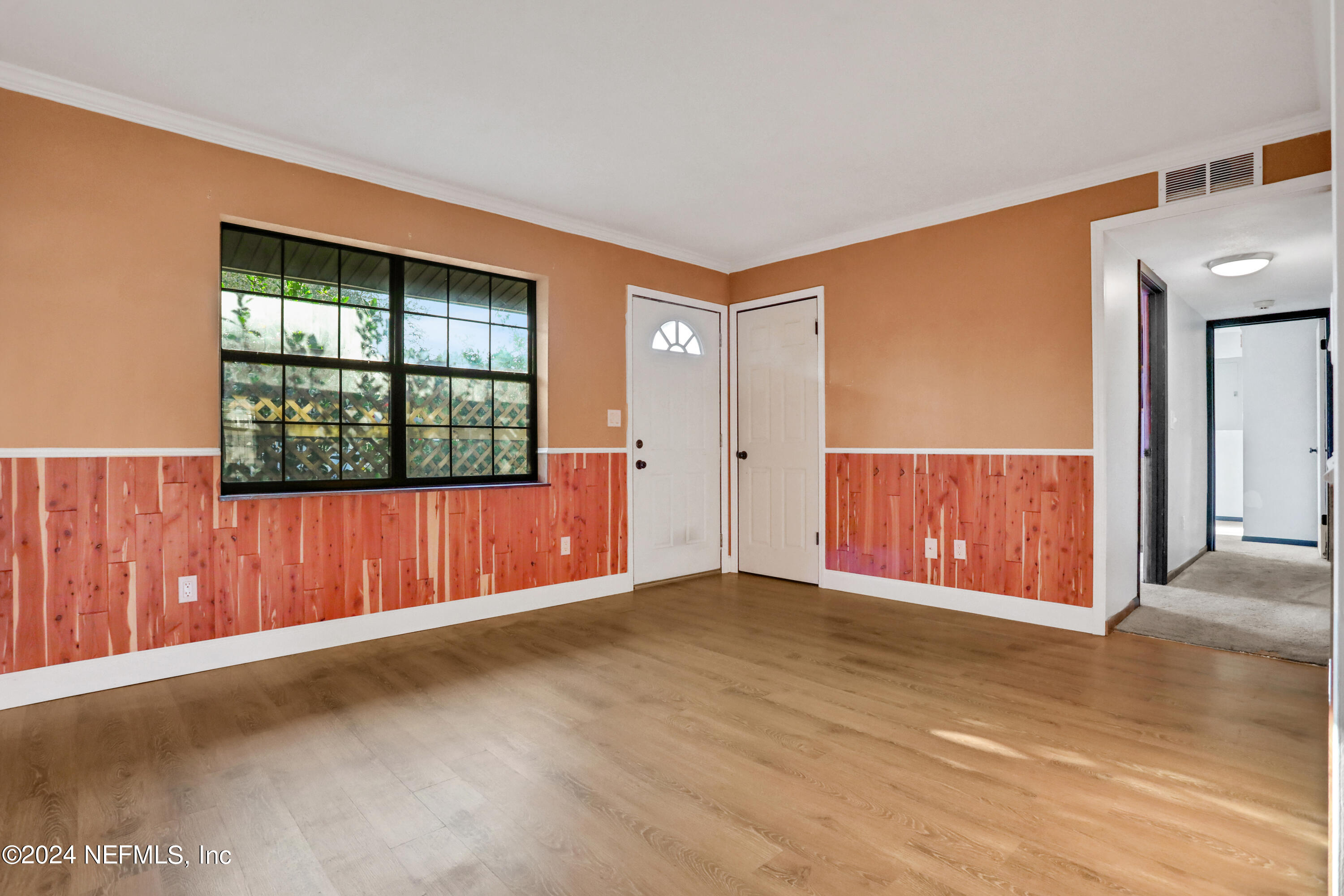 230 Cornell Road St. Augustine, FL 32086 - Photo 11 of 32 an empty room with windows