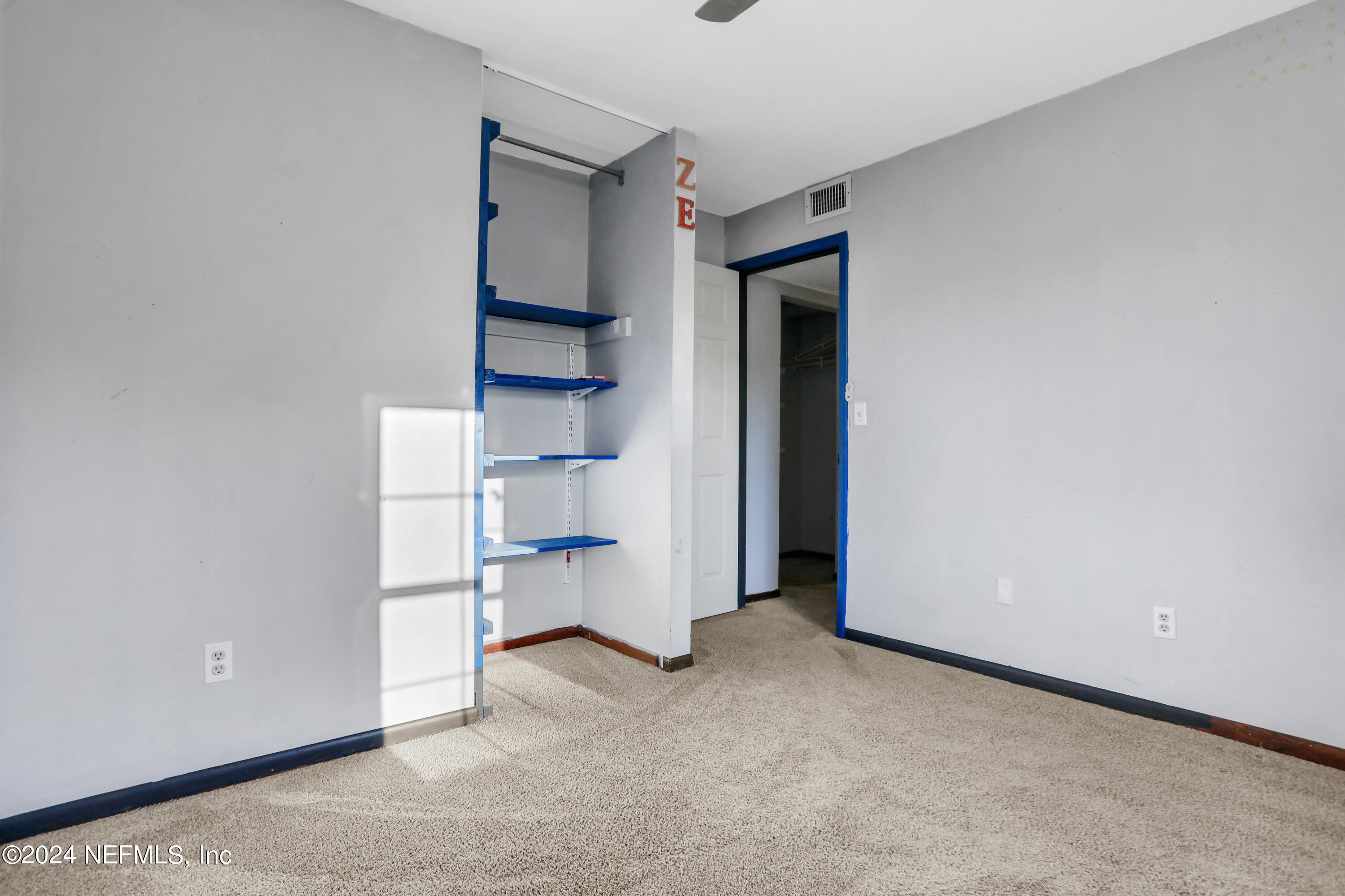 230 Cornell Road St. Augustine, FL 32086 - Photo 16 of 32 a view of an empty room with closet and racks