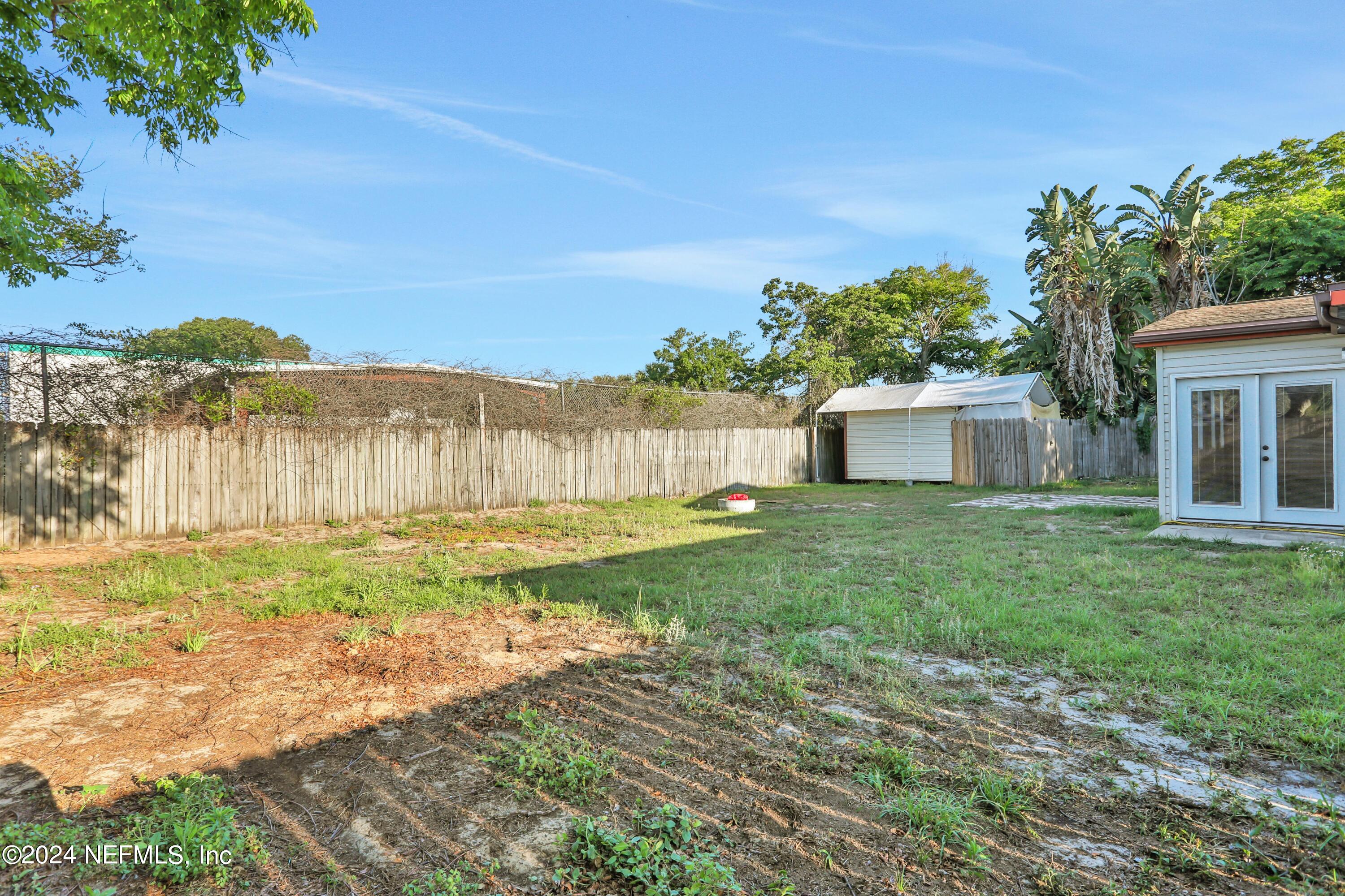 230 Cornell Road St. Augustine, FL 32086 - Photo 31 of 32 a front view of a house with garden