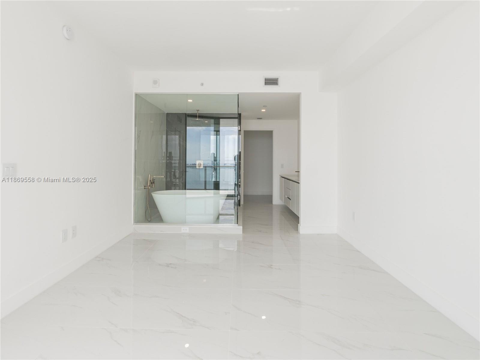 700 Northeast 24th Street, Unit 3606 Miami, FL 33137 - Photo 12 of 28 a view of a hallway with a white walls
