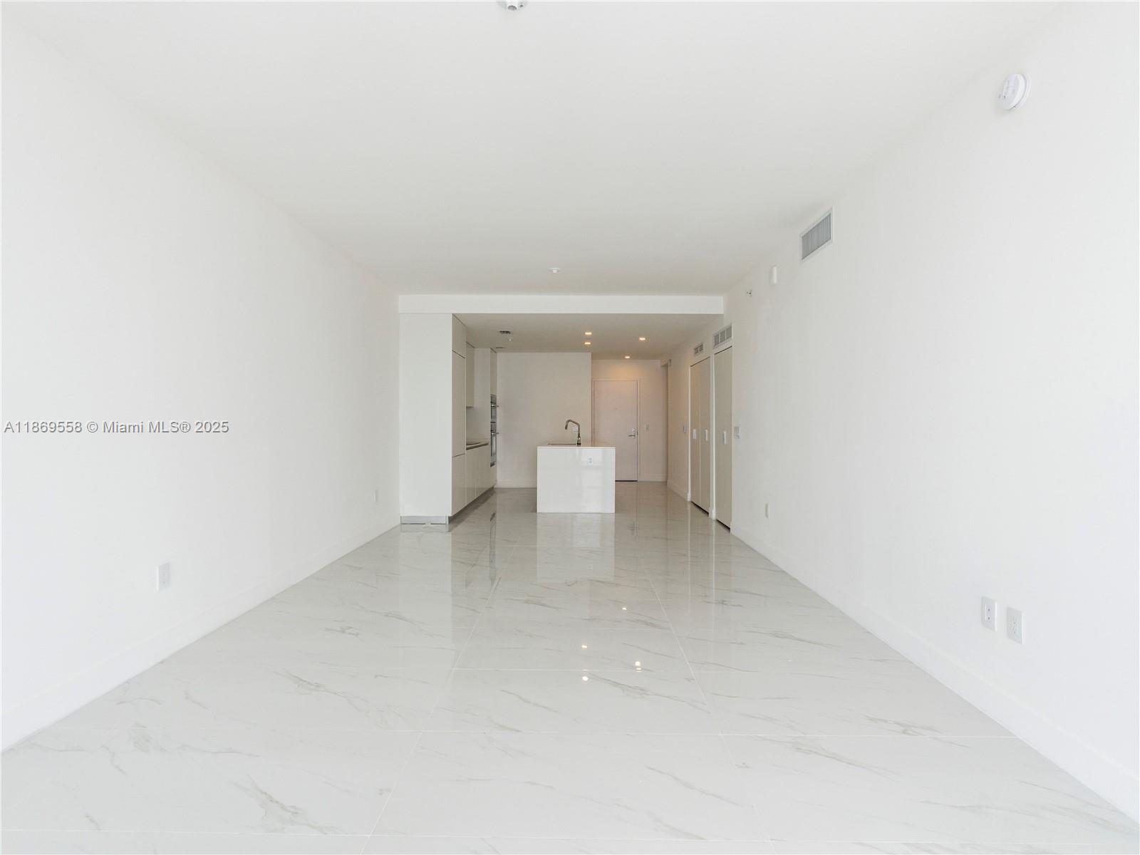 700 Northeast 24th Street, Unit 3606 Miami, FL 33137 - Photo 20 of 28 a view of a room that has a white bench in it