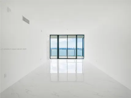 a kitchen with a sink and a refrigerator