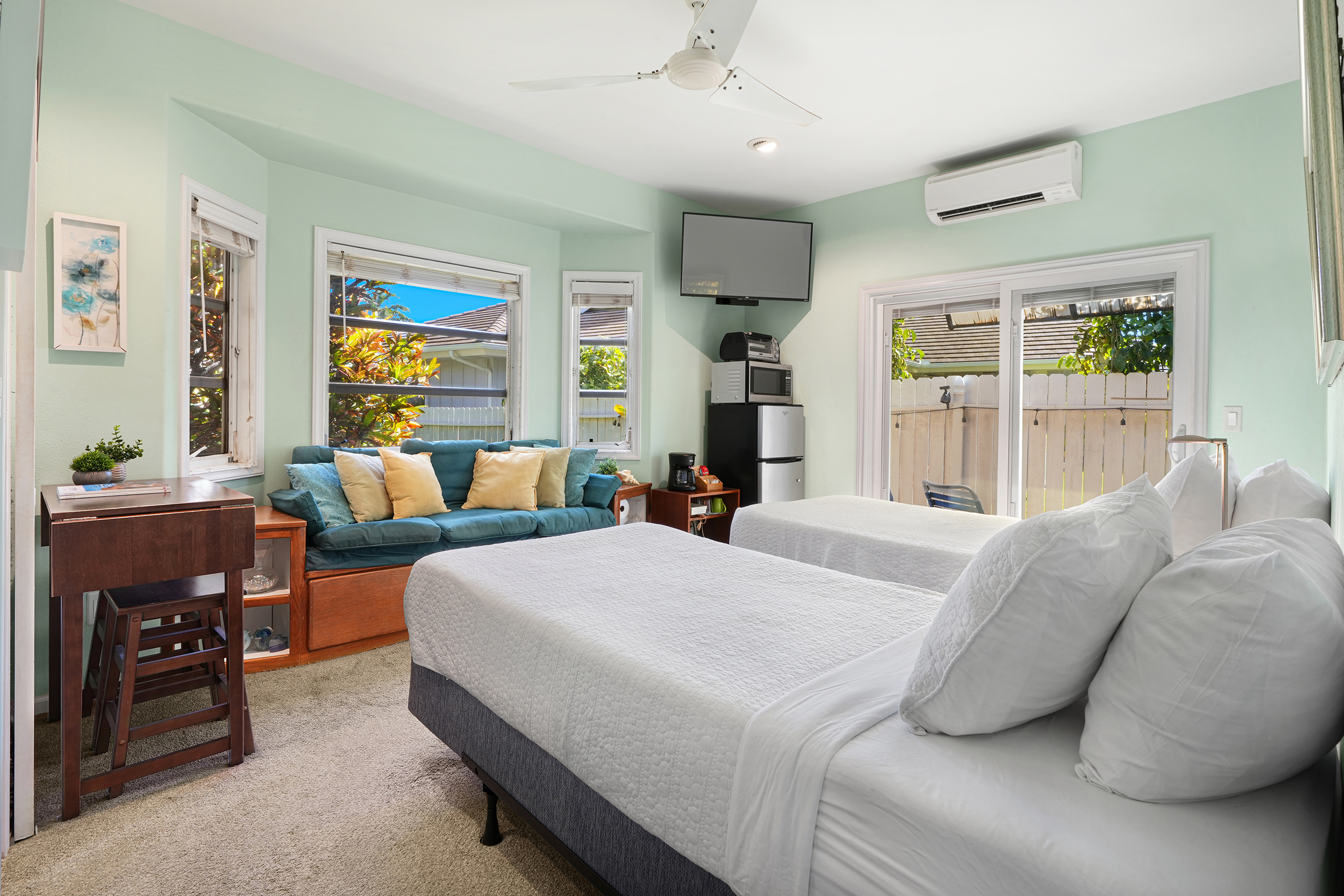 2255 Loke Road Koloa, HI 96756 - Photo 11 of 17 a bedroom with a bed and wooden floor