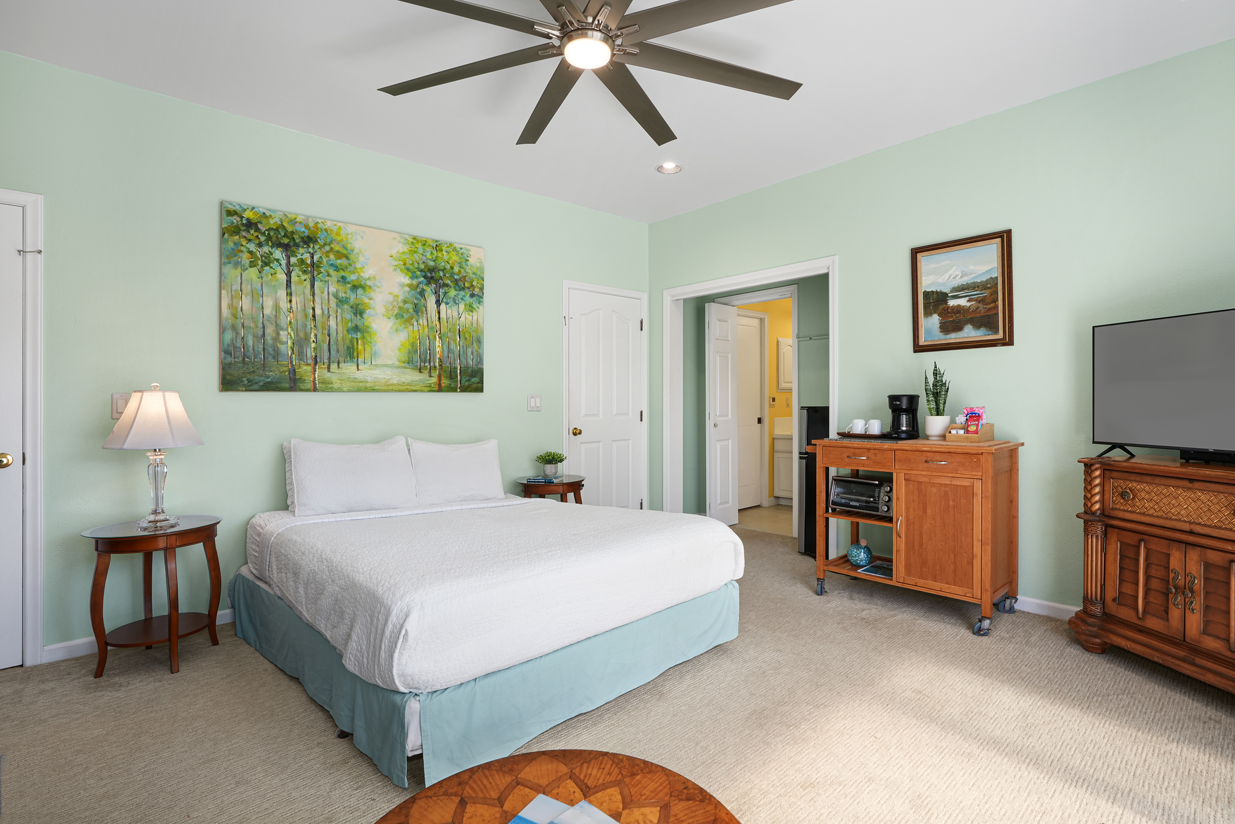 2255 Loke Road Koloa, HI 96756 - Photo 12 of 17 a bedroom with a bed and a chandelier