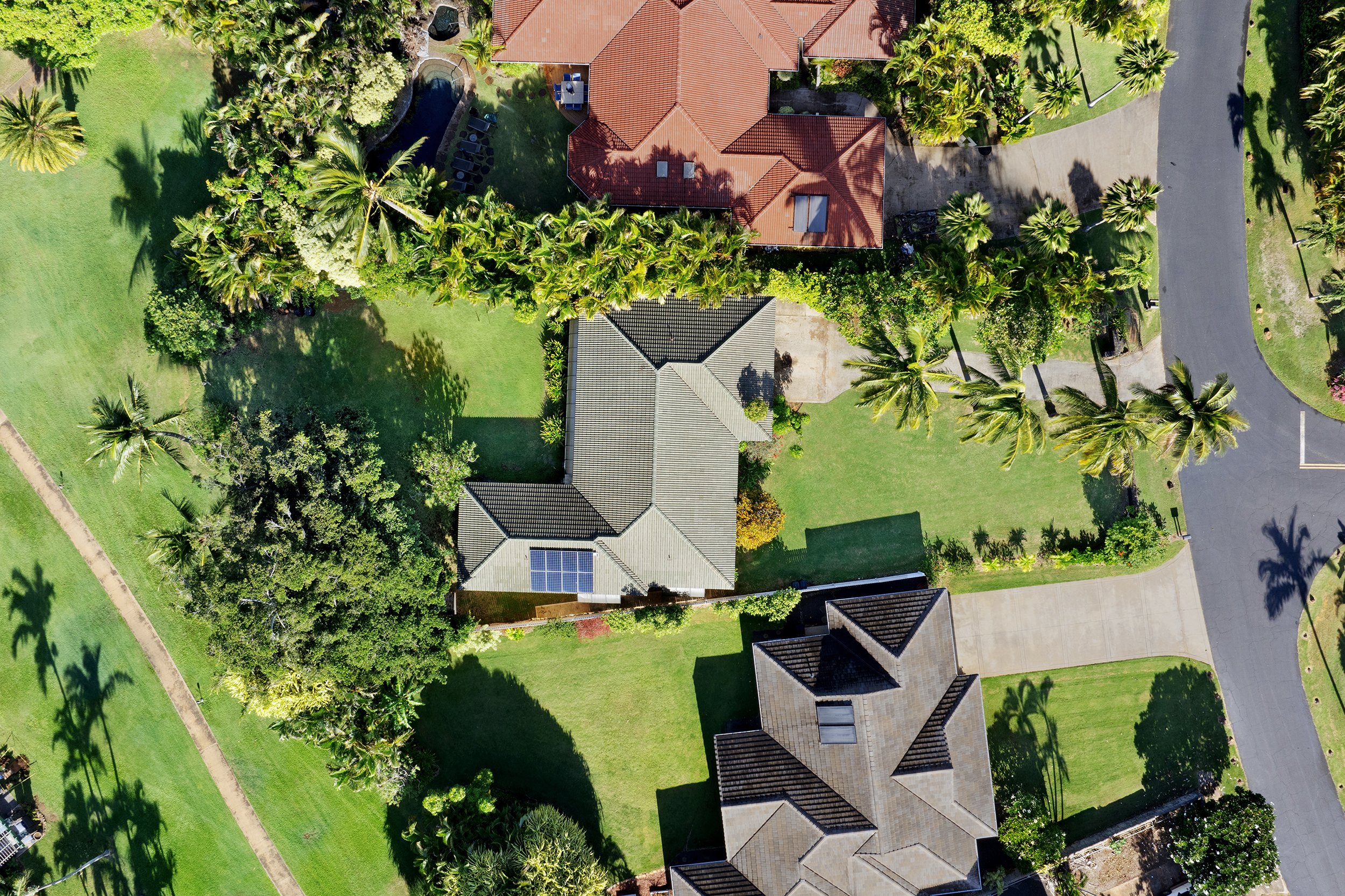2255 Loke Road Koloa, HI 96756 - Photo 13 of 17 an aerial view of a house with a yard and garden