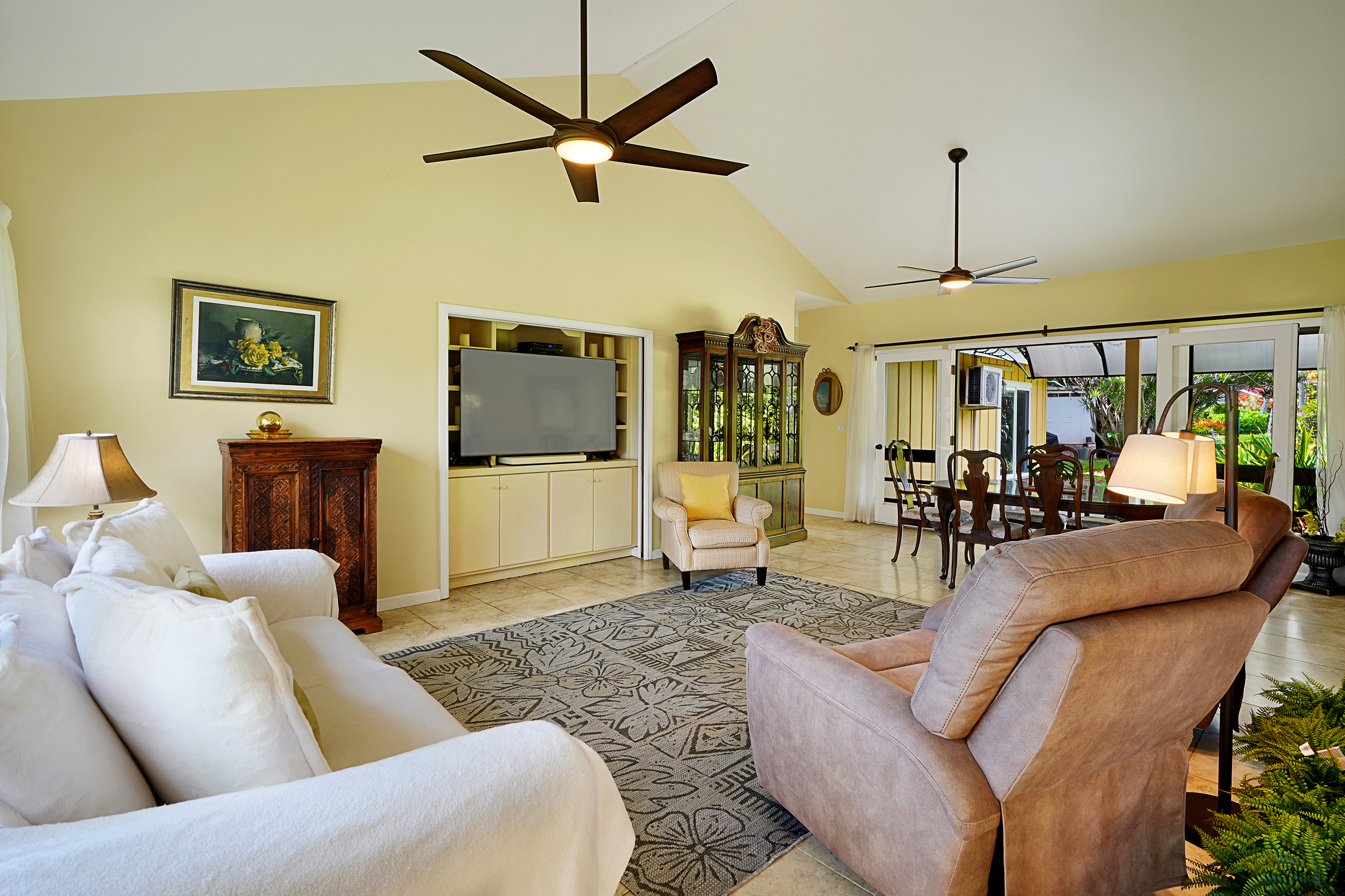 2255 Loke Road Koloa, HI 96756 - Photo 8 of 17 a living room with furniture and a flat screen tv