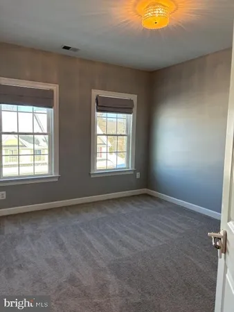 a view of a hallway with entryway door