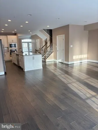 a view of a living room and kitchen with furniture and a kitchen view