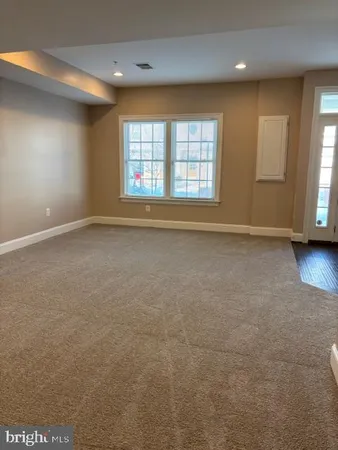 a view of livingroom with window and wooden floor