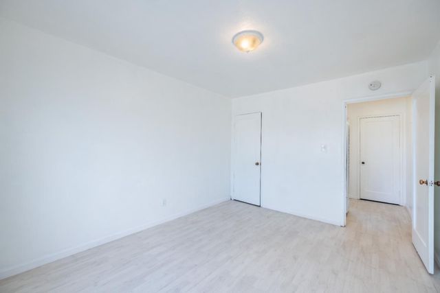 a bath room with a toilet a bath tub and a sink