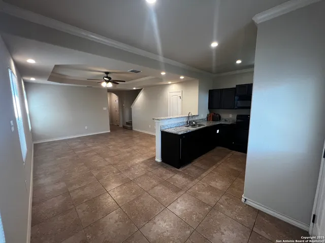 a large bathroom with a sink and a mirror