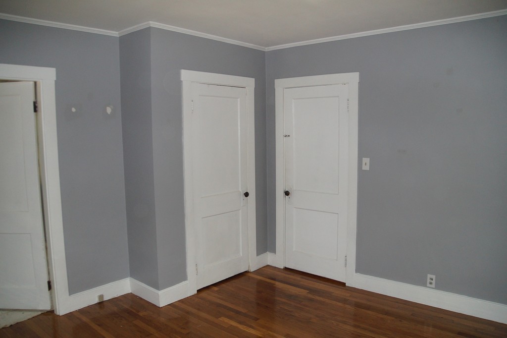 5 Harvard Road Billerica, MA 01821 - Photo 17 of 29 a view of an empty room with wooden floor