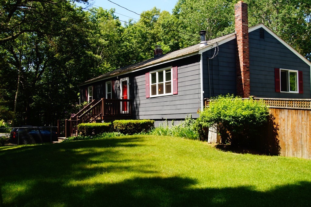 5 Harvard Road Billerica, MA 01821 - Photo 3 of 29 a front view of a house with a garden