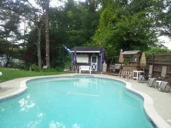 5 Harvard Road Billerica, MA 01821 - Photo 5 of 29 a view of a swimming pool with a patio