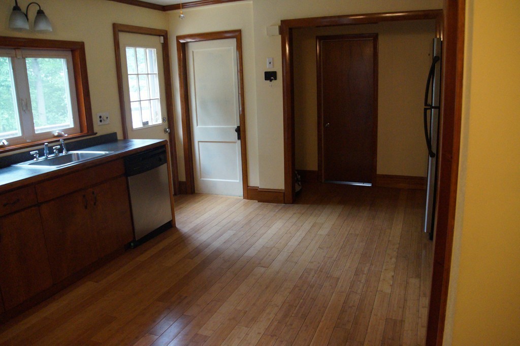 5 Harvard Road Billerica, MA 01821 - Photo 9 of 29 a view of a room with wooden floor and staircase