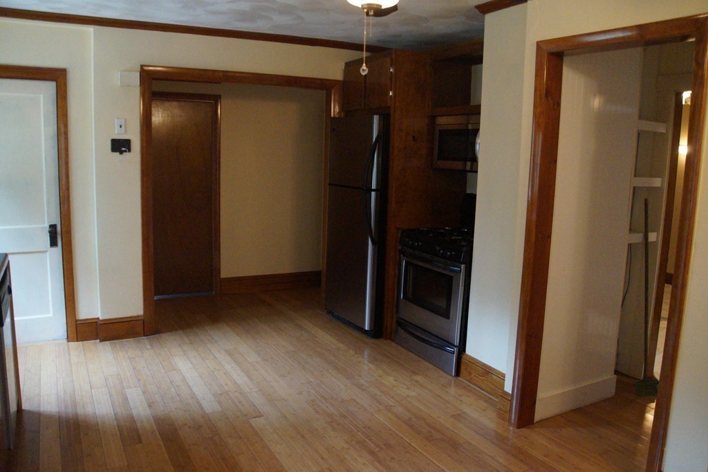5 Harvard Road Billerica, MA 01821 - Photo 10 of 29 a view of a hallway with wooden floor and closet