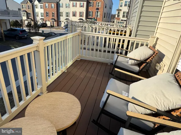 a view of a balcony with wooden floor