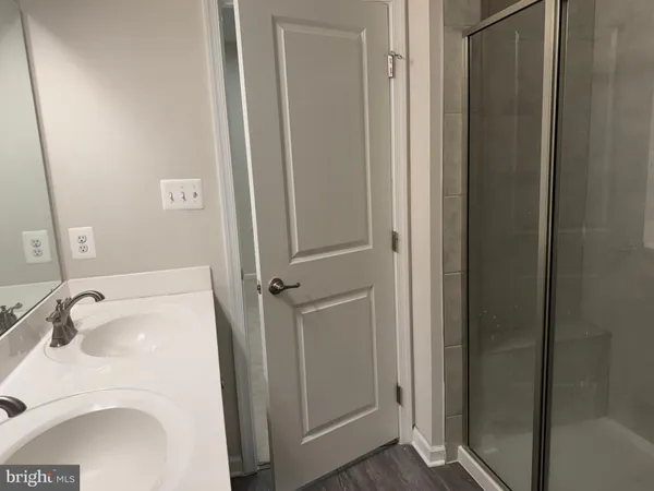 a bathroom with a sink and vanity