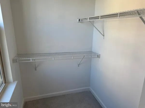 a view of a room with racks on the wall