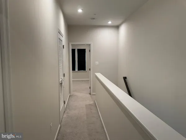 a view of hallway with stairs