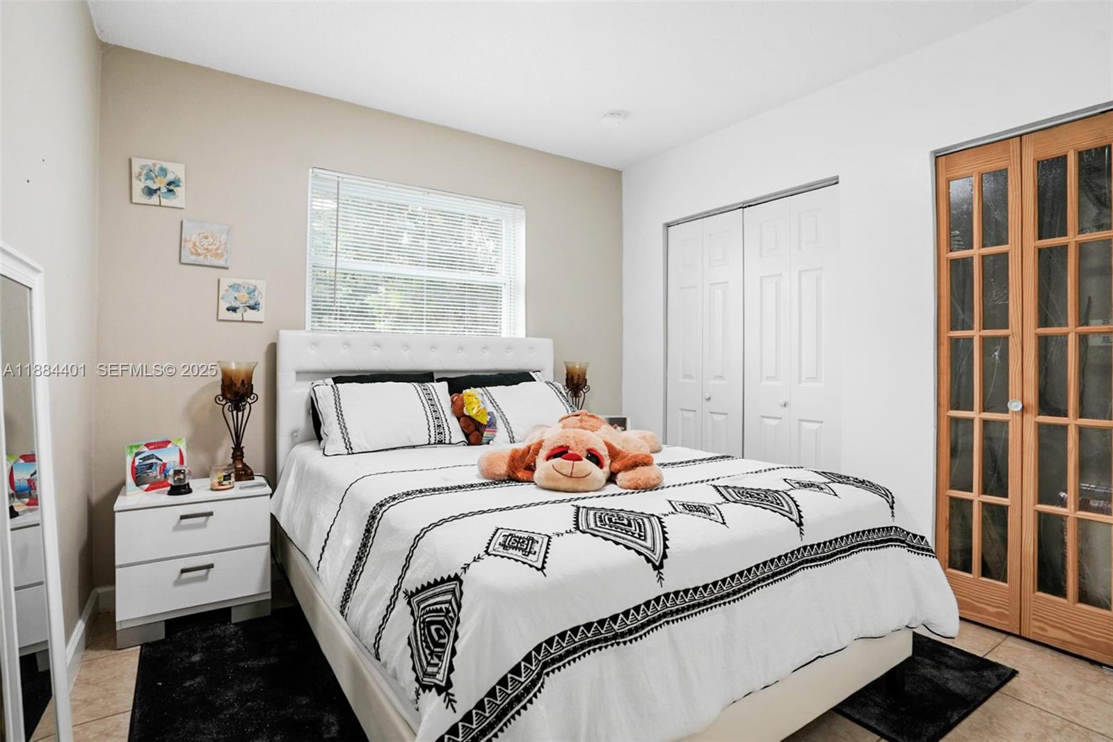 621 Southwest 50th Terrace Margate, FL 33068 - Photo 6 of 18 a bedroom with bed and a window