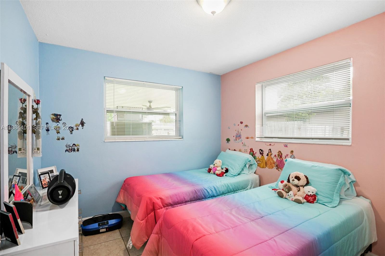 621 Southwest 50th Terrace Margate, FL 33068 - Photo 8 of 18 a bedroom with a bed and a window