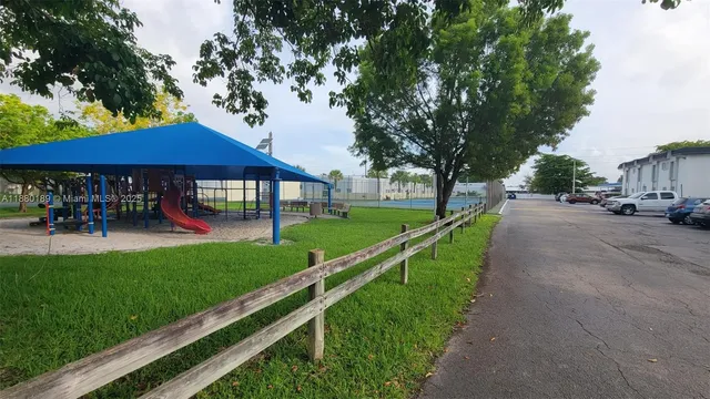 a view of a park with large trees
