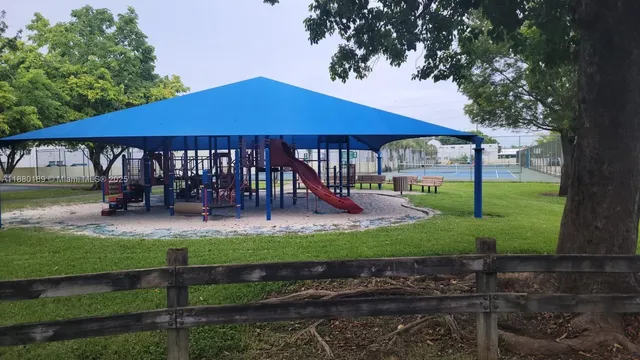 a view of a house with backyard porch and sitting area