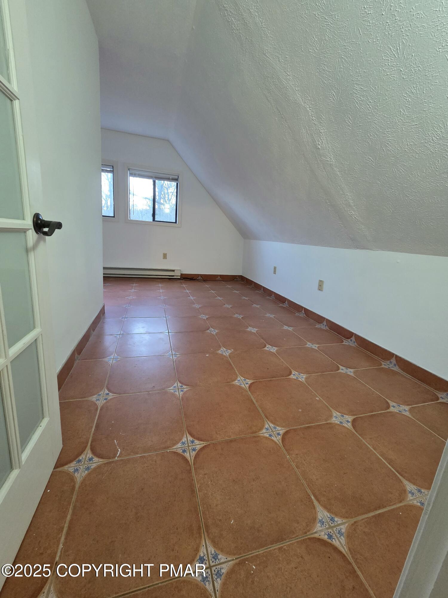 107 Berkshire Court Bushkill, PA 18324 - Photo 14 of 16 a view of a big room with wooden floor and windows