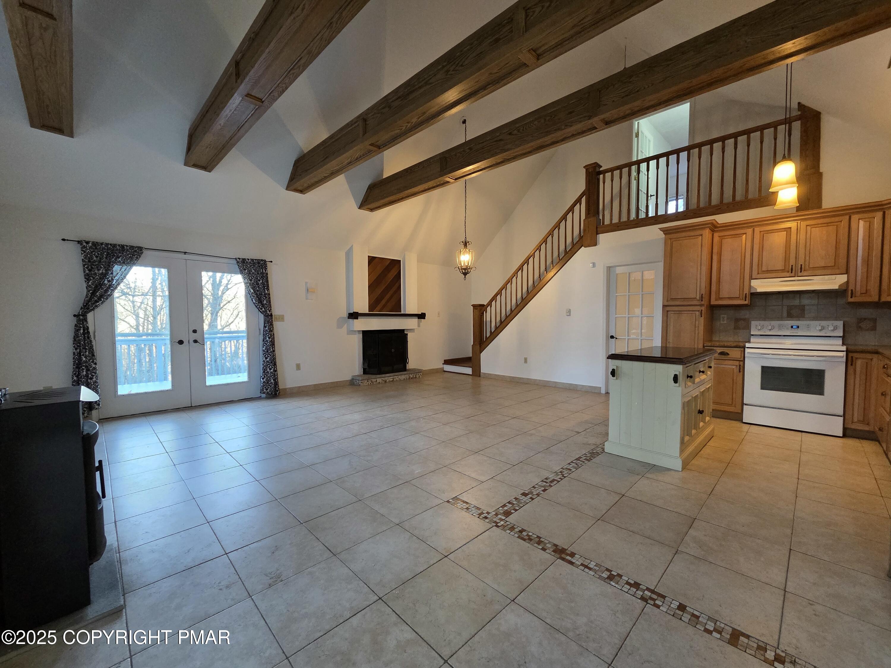 107 Berkshire Court Bushkill, PA 18324 - Photo 4 of 16 a view of a kitchen with furniture and staircase