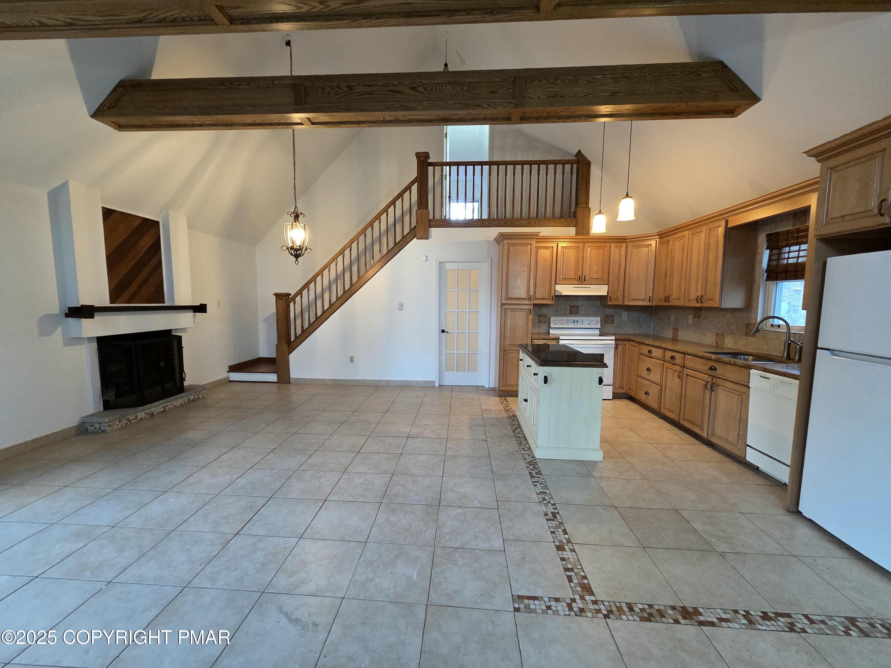 107 Berkshire Court Bushkill, PA 18324 - Photo 5 of 16 a kitchen with stainless steel appliances granite countertop a refrigerator and a stove top oven