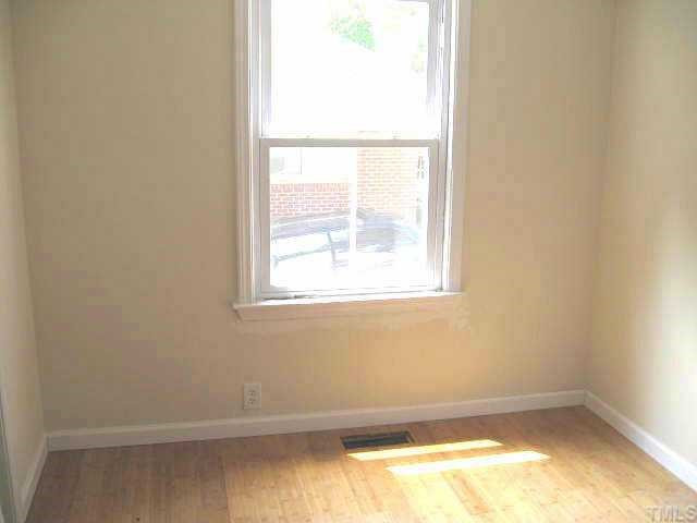 2320 Stevens Road Raleigh, NC 27610 - Photo 3 of 10 Bright dining area with built-in glass cabinet & new bamboo floor Other