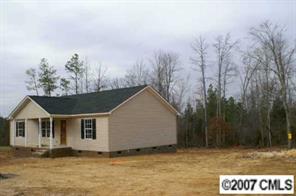 374 Sutton Spring Road York, SC 29745 - Photo 3 of 8 a view of a house with a yard