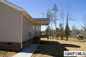 374 Sutton Spring Road York, SC 29745 - Photo 5 of 8 a view of a house with a yard