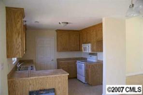 374 Sutton Spring Road York, SC 29745 - Photo 6 of 8 a kitchen with a sink cabinets and window