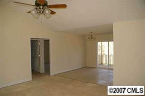 374 Sutton Spring Road York, SC 29745 - Photo 8 of 8 an empty room with windows and closet