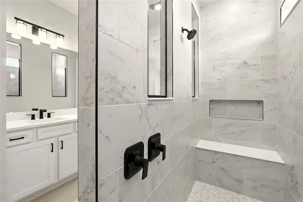 a bathroom with a sink and a mirror