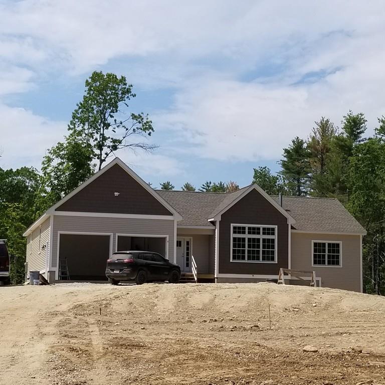 5 Valley Road, Unit LOT 7 Lunenburg, MA 01462 - Photo 1 of 2 a front view of a house with a yard