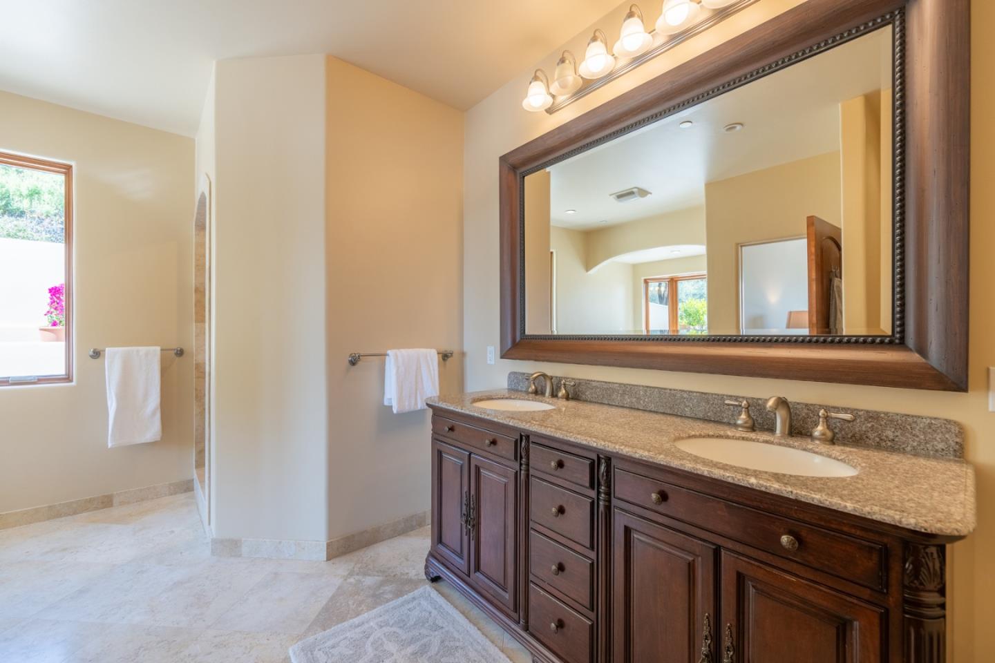 67 Tucker Road Watsonville, CA 95076 - Photo 19 of 32 a bathroom with a granite countertop sink vanity and a mirror